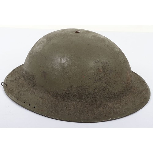 46 - WW1 American Steel Helmet, being a M-17 steel helmet with a light green overpaint rough textured fin... 