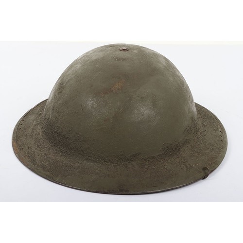 46 - WW1 American Steel Helmet, being a M-17 steel helmet with a light green overpaint rough textured fin... 