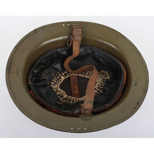 46 - WW1 American Steel Helmet, being a M-17 steel helmet with a light green overpaint rough textured fin... 