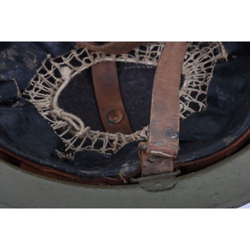 46 - WW1 American Steel Helmet, being a M-17 steel helmet with a light green overpaint rough textured fin... 