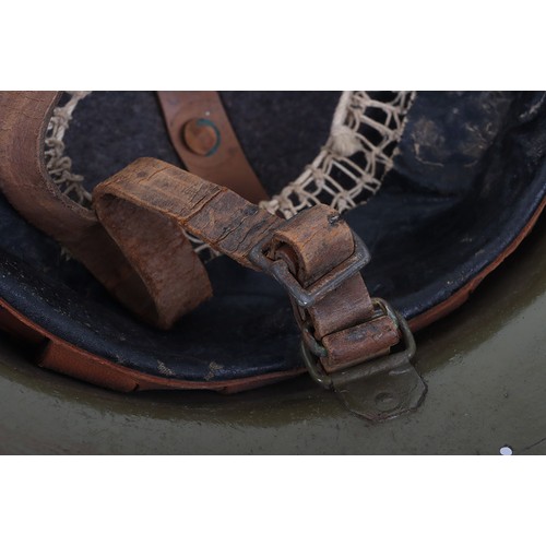 46 - WW1 American Steel Helmet, being a M-17 steel helmet with a light green overpaint rough textured fin... 