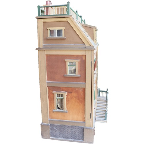 3 - ‘DollyHolme’ an early 20th century well-made wooden dolls house and contents, the painted wooden dol... 