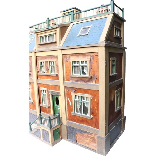 3 - ‘DollyHolme’ an early 20th century well-made wooden dolls house and contents, the painted wooden dol... 