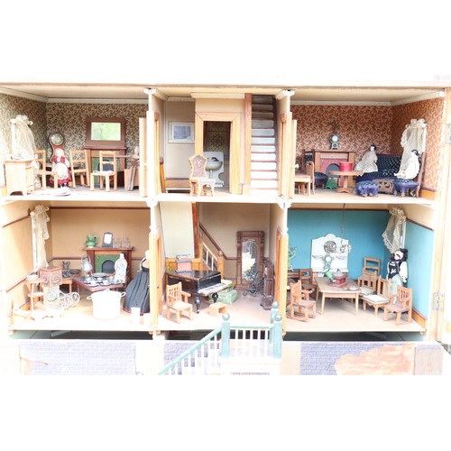 3 - ‘DollyHolme’ an early 20th century well-made wooden dolls house and contents, the painted wooden dol... 