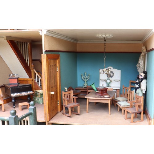 3 - ‘DollyHolme’ an early 20th century well-made wooden dolls house and contents, the painted wooden dol... 