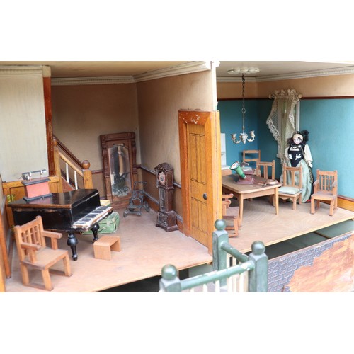 3 - ‘DollyHolme’ an early 20th century well-made wooden dolls house and contents, the painted wooden dol... 