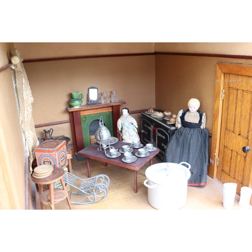 3 - ‘DollyHolme’ an early 20th century well-made wooden dolls house and contents, the painted wooden dol... 