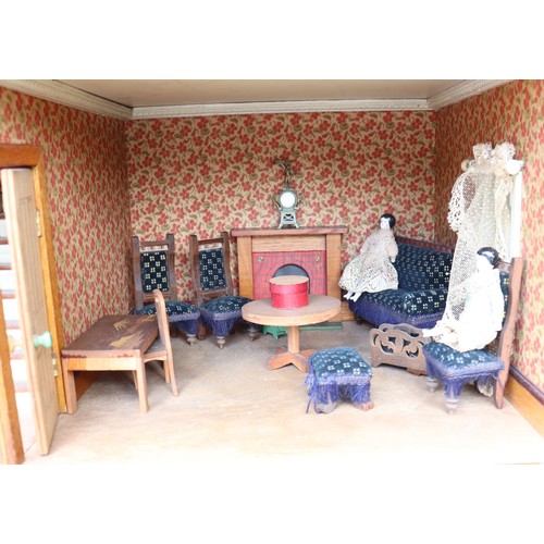 3 - ‘DollyHolme’ an early 20th century well-made wooden dolls house and contents, the painted wooden dol... 