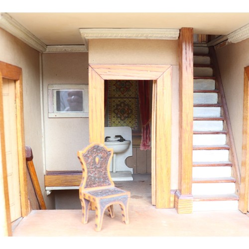 3 - ‘DollyHolme’ an early 20th century well-made wooden dolls house and contents, the painted wooden dol... 