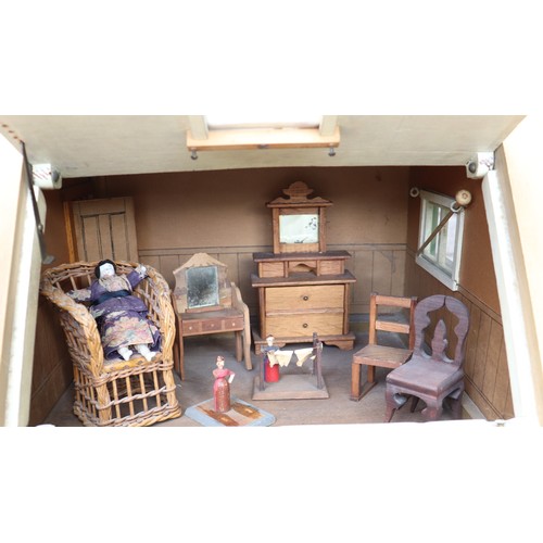 3 - ‘DollyHolme’ an early 20th century well-made wooden dolls house and contents, the painted wooden dol... 
