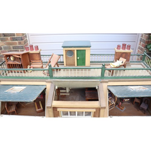 3 - ‘DollyHolme’ an early 20th century well-made wooden dolls house and contents, the painted wooden dol... 