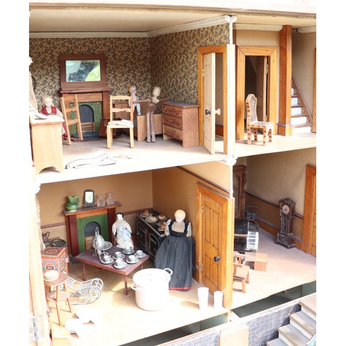 3 - ‘DollyHolme’ an early 20th century well-made wooden dolls house and contents, the painted wooden dol... 