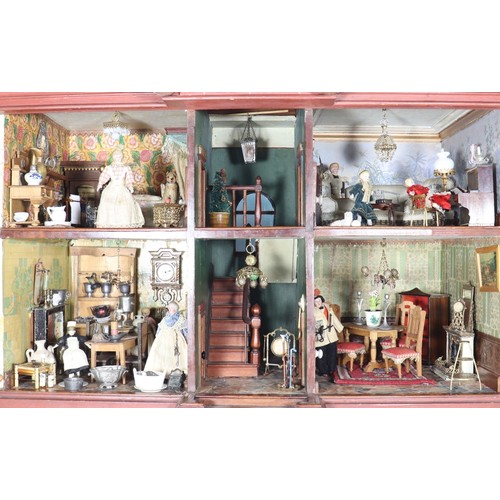 2 - A good painted red brick wooden Victorian Dolls house in the Gothic style, with contents, the façade... 