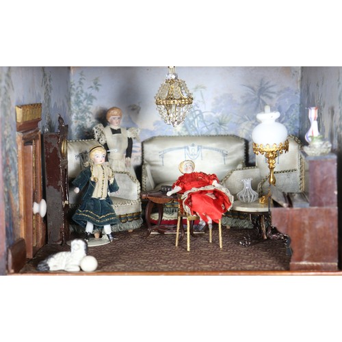 2 - A good painted red brick wooden Victorian Dolls house in the Gothic style, with contents, the façade... 