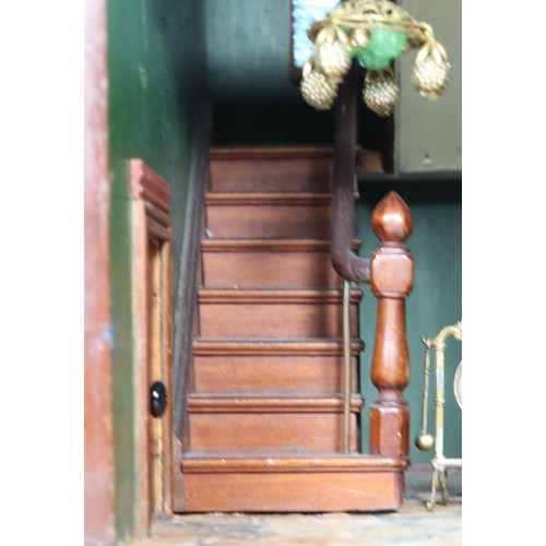 2 - A good painted red brick wooden Victorian Dolls house in the Gothic style, with contents, the façade... 