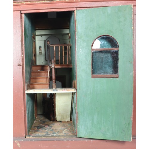 2 - A good painted red brick wooden Victorian Dolls house in the Gothic style, with contents, the façade... 