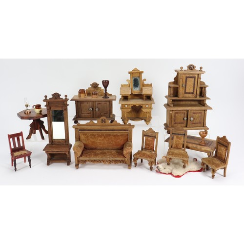 8 - A collection of wooden dolls house furniture, German circa 1900, including a peach velvet upholstere... 