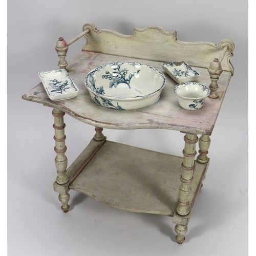 27 - A painted wooden French style Victorian Dolls washstand, painted cream and pink stand with decorativ... 