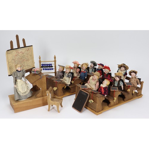 20 - A good miniature schoolroom with twelve pupils, teacher and accessories, German circa 1900, with six... 
