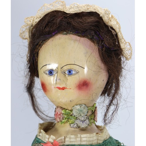 45 - A good early English George II painted wooden doll, circa 1750, the gesso head with inset blue glass... 