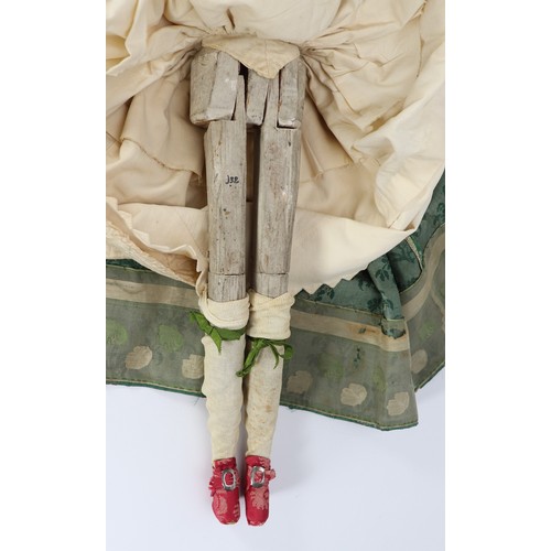 45 - A good early English George II painted wooden doll, circa 1750, the gesso head with inset blue glass... 