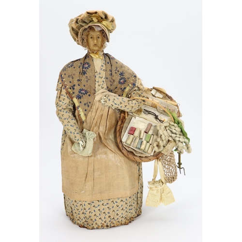 48 - An early nineteenth century English wax peddler doll, the bees wax head with black beaded eyes, pain... 