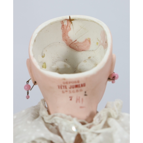 59 - A Tete Jumeau bisque head Bebe doll, size 7, French circa 1890, the pale bisque head with fixed blue... 
