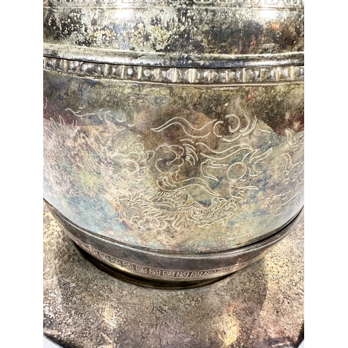 43 - A large Chinese silver plated 3 piece tureen, decorated with etched dragons with plated tray (2).