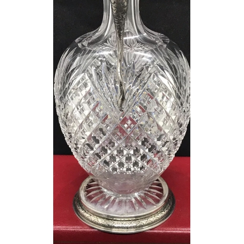 28 - A silver cut glass rare decanter 
Possibly Faberge 

Height 23cm
Diameter base 7.2cm