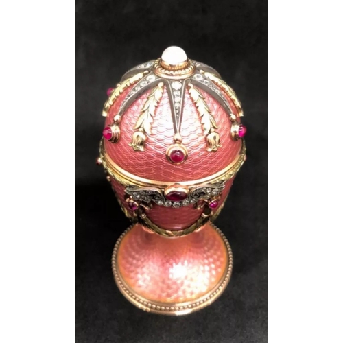 60 - Faberge 14k Solid gold and enamel faberge suprise egg. Set with top moonstone and diamonds eggs open... 