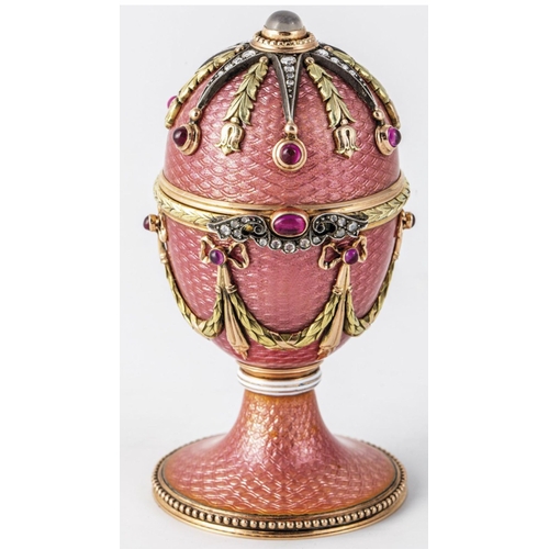 60 - Faberge 14k Solid gold and enamel faberge suprise egg. Set with top moonstone and diamonds eggs open... 