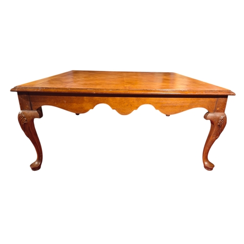 115 - A large mahogany square coffee table upon cabriole legs 102cm.