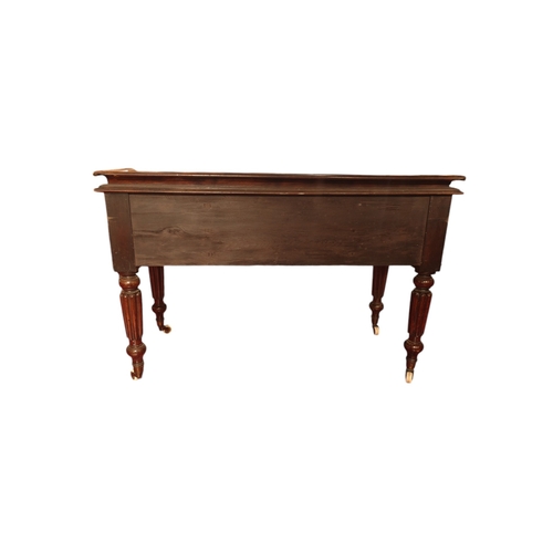 117 - A Victorian mahogany writing desk with 5 drawers & frieze top on reeded turned legs 120cm wide.