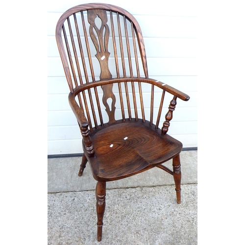 557 - A reproduction Windsor chair with crinoline stretcher