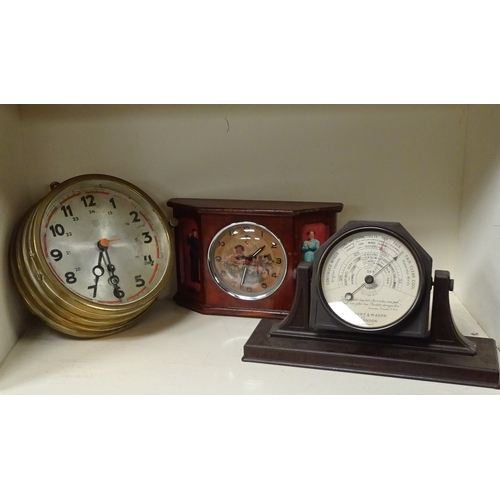 124 - A Junghans brass cased bulkhead style clock; a Chairman Mao Chinese mantel clock; a Short & Mason Ba... 