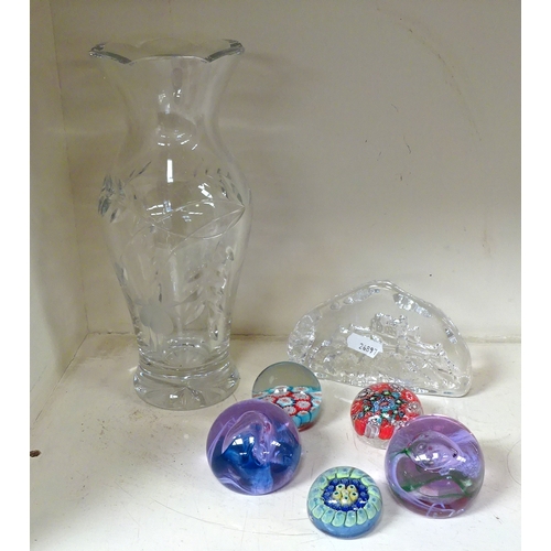 133 - Six various glass paperweights, a Royal Doulton glass vase.