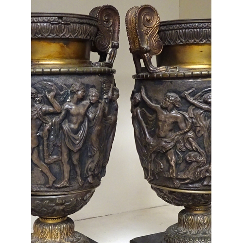 144 - A pair of classical influence urn vases, base metal a/f