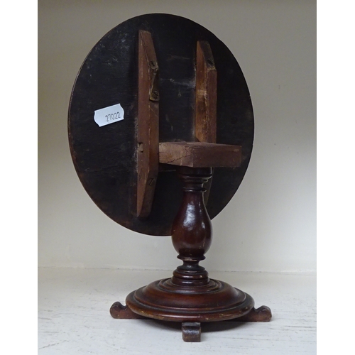 145 - A miniature circular tilt top table