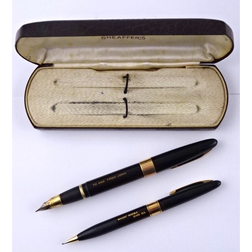 341 - A Sheaffer fountain pen and mechanical pencil set in original case c1950; an onyx based desk pen; an... 