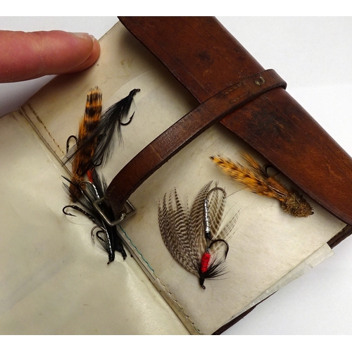 350 - Angling interest: a Hardy Brothers leather fly case with a small collection of fishing flies.