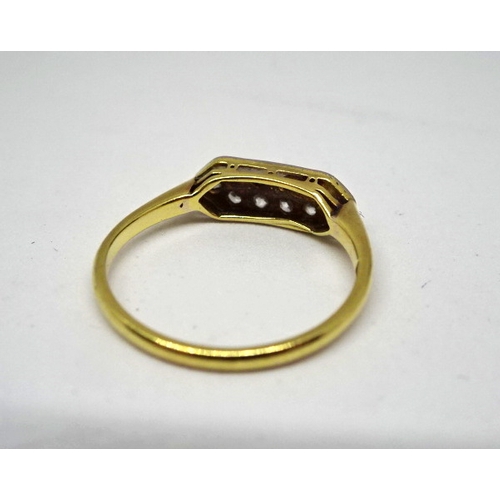 370 - A ring constituting ten brilliant cut white stones in an elongated hexagonal yellow metal head on a ... 