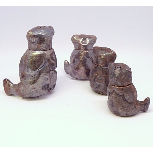 446 - Four Oriental novelty bear form shaker / condiment pots, unmarked, a/f dents.  Largest 55mm tall