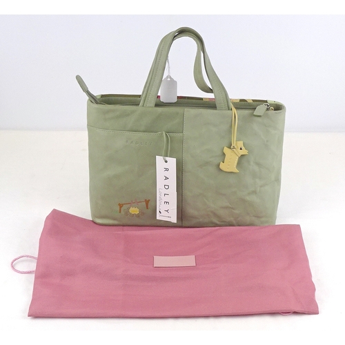 197 - A Radley handbag having fabric cover bag