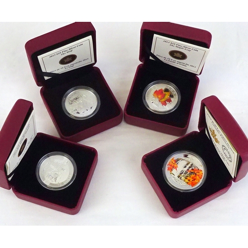 323 - Three O Canada 2013 10 Dollar collectors' coins: The Maple Leaf, Canadian Holiday Season, The Wolf, ... 