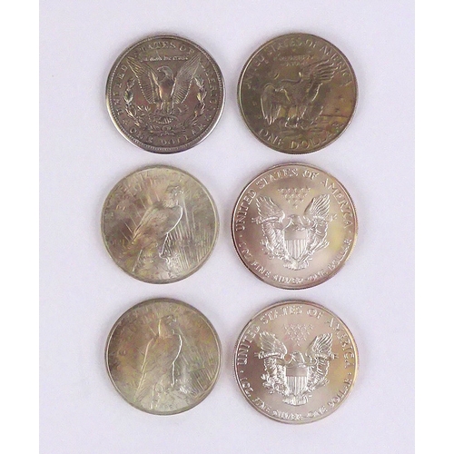 329 - Seven USA One Dollar coins: 1921, 1923, 1923, 1972, 1999, 2013.