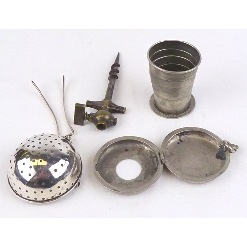 348 - A Continental tea strainer; a patent folding cup; a champagne tap. (3)