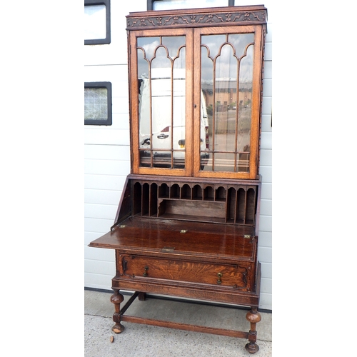 709 - A 1930's oak bureau bookcase, fall warped 92cm wide