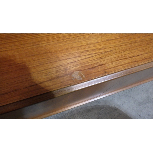 734 - A G.Plan teak three section side unit, some marks, 306cm wide