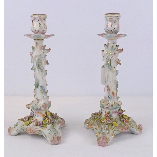 224 - A pair of German porcelain candlesticks, possibly Sitzendorf.