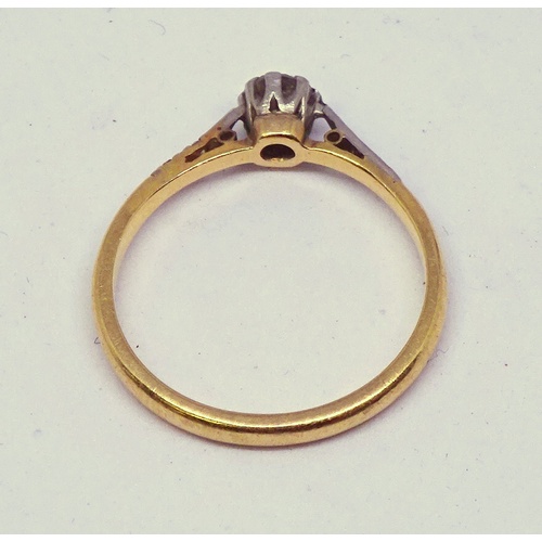 366 - A solitaire ring constituting a brilliant cut white stone in a raised white metal claw setting on a ... 